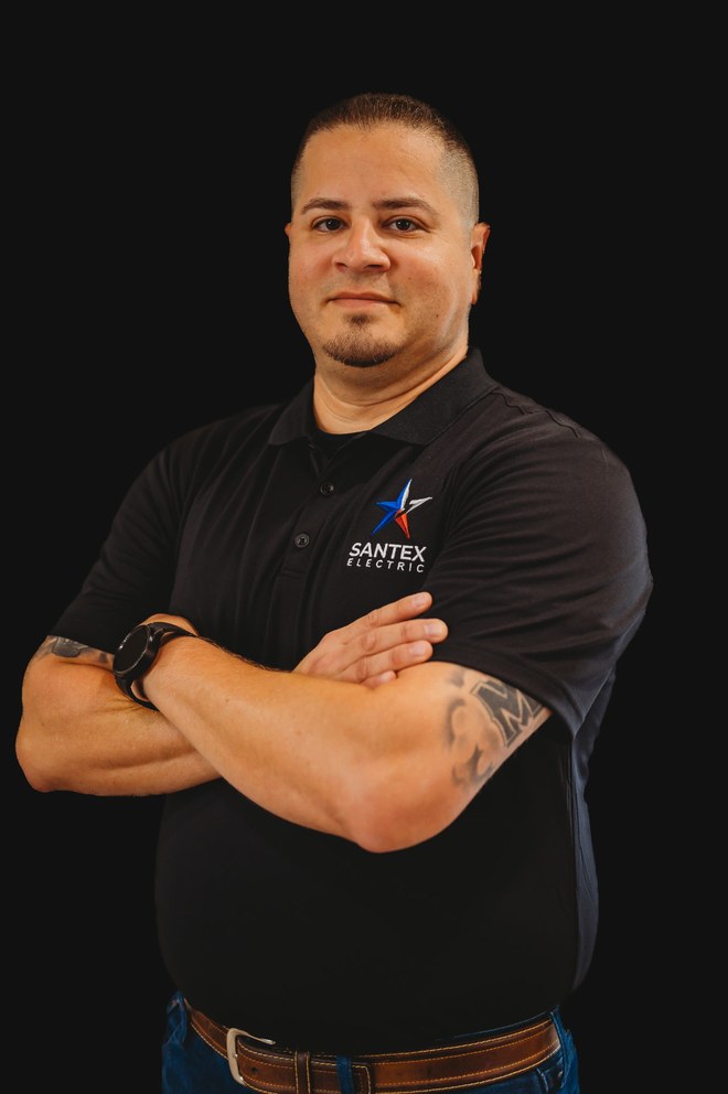 Lawrence Huizar, owner of Santex Electric, in a branded company polo